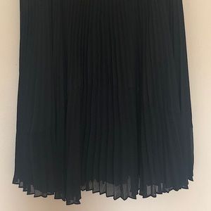Midi Black sheer and silky pleated skirt